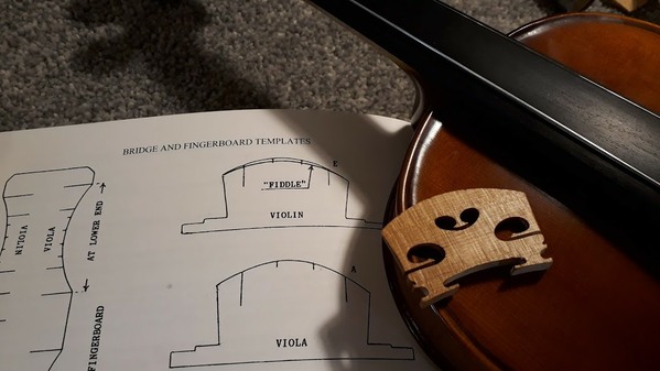 Violin on the bench with bridge templates